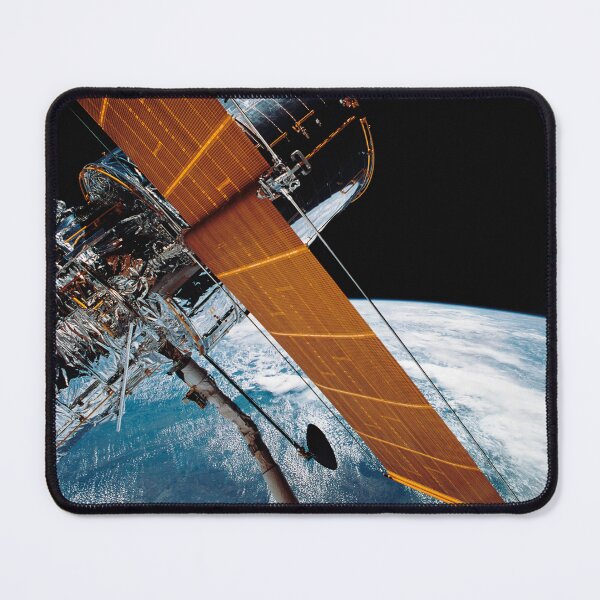 Item preview, STK204401S-The Hubble Space Telescope backdropped by planet Earth. designed and sold by StocktrekImages.
