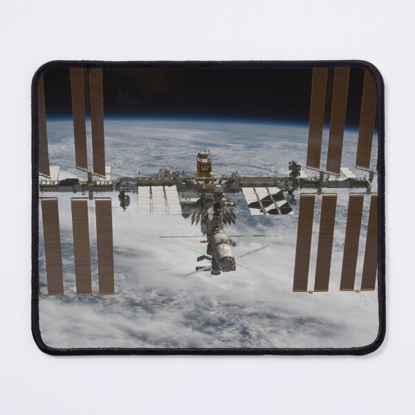Item preview, STK204666S-International Space Station backdropped against clouds over Earth. designed and sold by StocktrekImages.