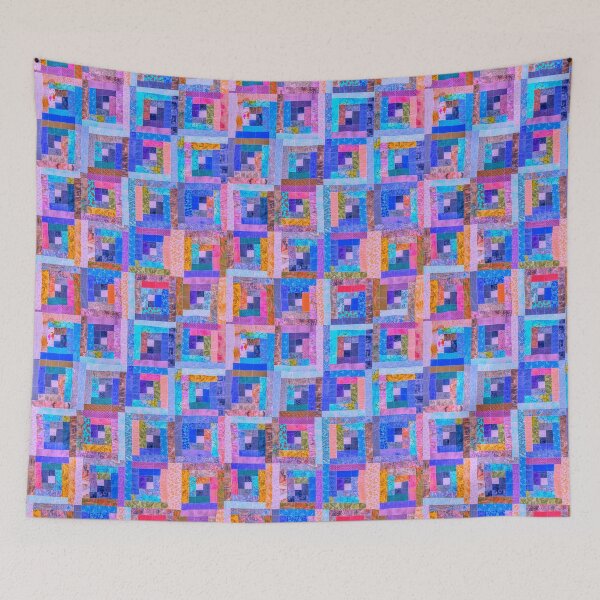 Item preview, DANCE OF PINK AND BLUE  IN LOG CABIN QUILT designed and sold by Jean Gregory Evans.