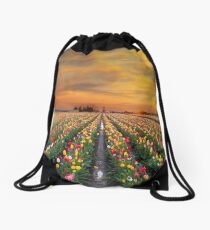 Sunset over colorful Tulip flower fields in full bloom during spring season tulip festival in Woodburn Oregon Drawstring Bag