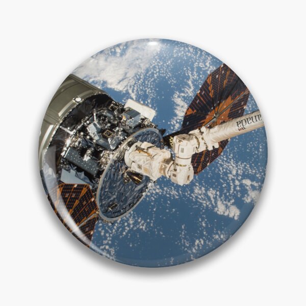 Item preview, STK204991S-Cygnus cargo spacecraft in the grips of the robotic arm above Earth. designed and sold by StocktrekImages.
