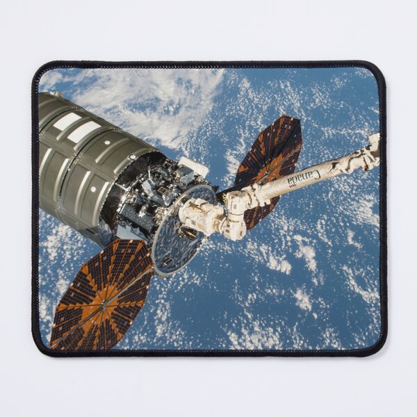 Item preview, STK204991S-Cygnus cargo spacecraft in the grips of the robotic arm above Earth. designed and sold by StocktrekImages.