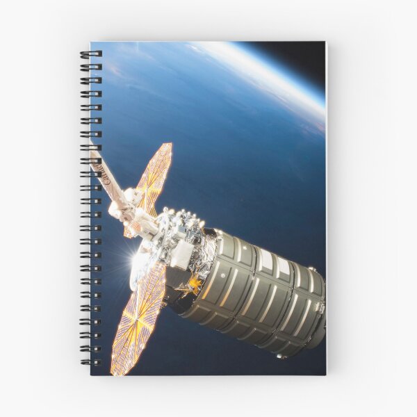 Item preview, STK204994S-Cygnus cargo spacecraft in the grips of the robotic arm above Earth. designed and sold by StocktrekImages.