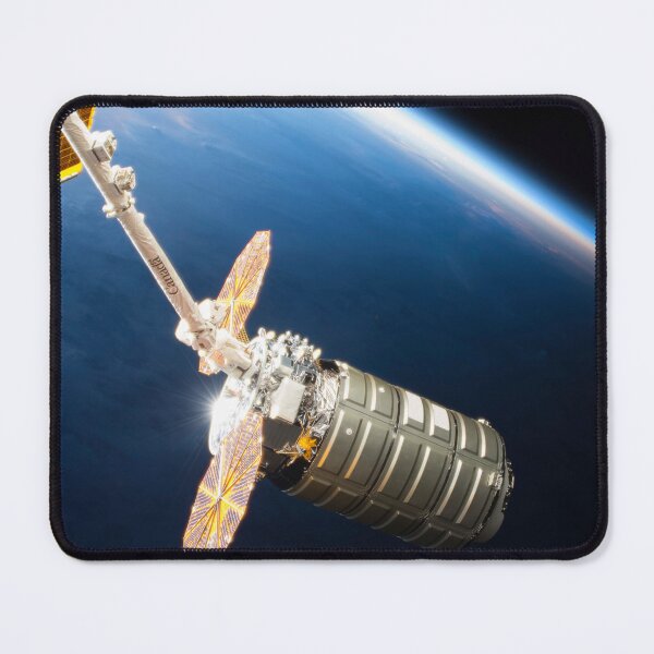 Item preview, STK204994S-Cygnus cargo spacecraft in the grips of the robotic arm above Earth. designed and sold by StocktrekImages.