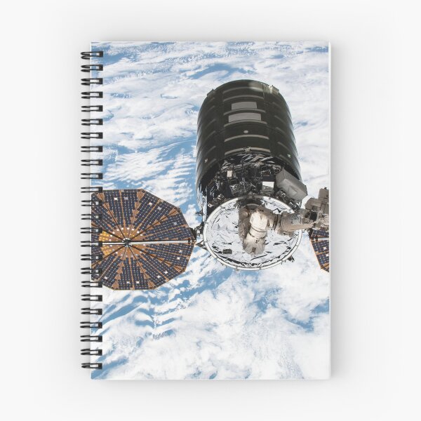 Item preview, STK204997S-Cygnus cargo spacecraft in the grips of the robotic arm above Earth. designed and sold by StocktrekImages.