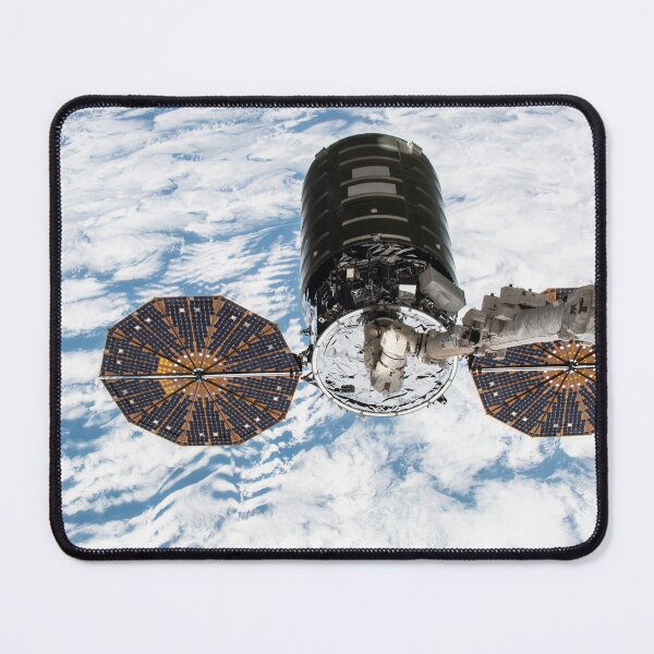 Item preview, STK204997S-Cygnus cargo spacecraft in the grips of the robotic arm above Earth. designed and sold by StocktrekImages.
