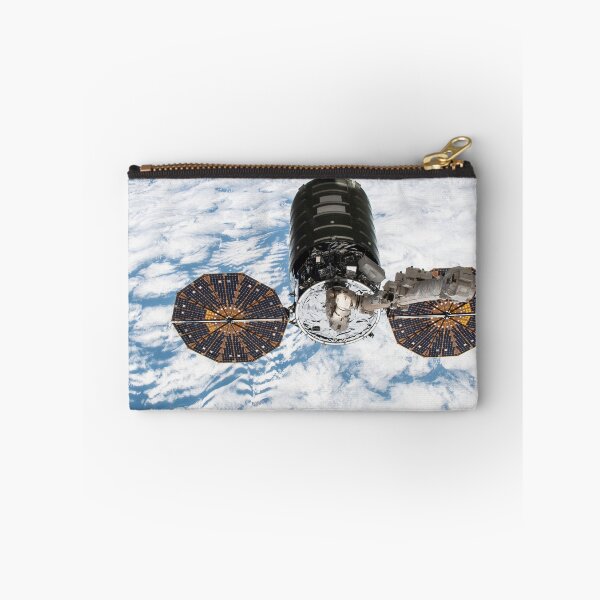 Item preview, STK204997S-Cygnus cargo spacecraft in the grips of the robotic arm above Earth. designed and sold by StocktrekImages.