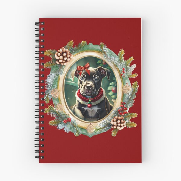 Item preview, A cute black puppy dog wearing a festive bow and dog collar, in a winter Christmas picture frame with pinecones and winter berries designed and sold by WitchDesign.