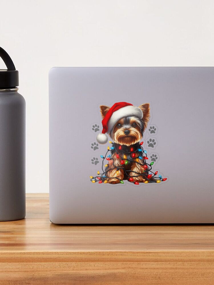 Dog Christmas Yorkshire Terrier wrapped with Christmas lights on new year eve Sticker