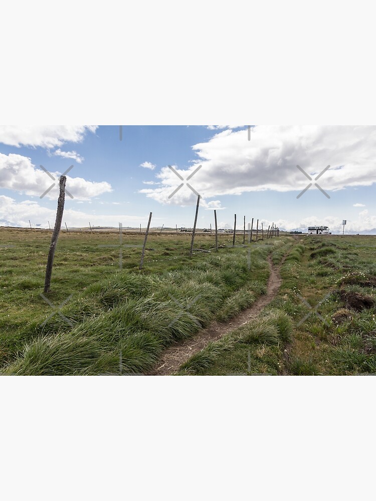 Farm field fence posts with dirt trail in grass, Ecuador by kpander