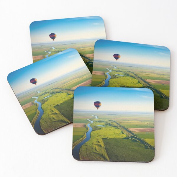 Item preview, Air balloon in the sky passing over hills and river - Landscape photography designed and sold by TheArtistOf2022.
