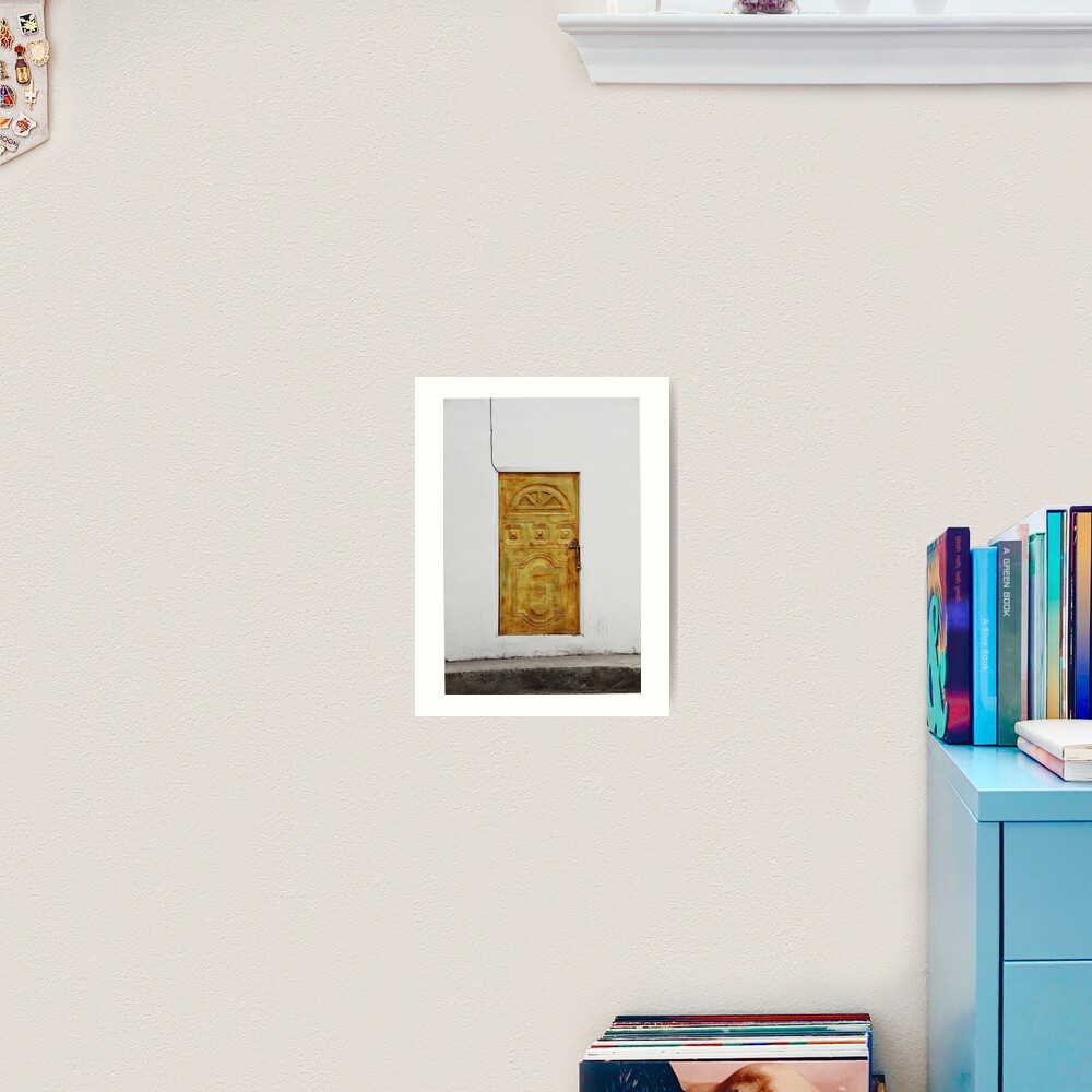 Golden yellow door in white wall Art Print