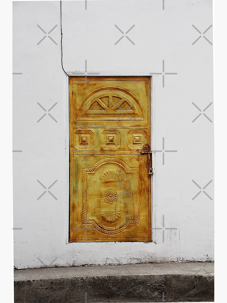 Golden yellow door in white wall by kpander