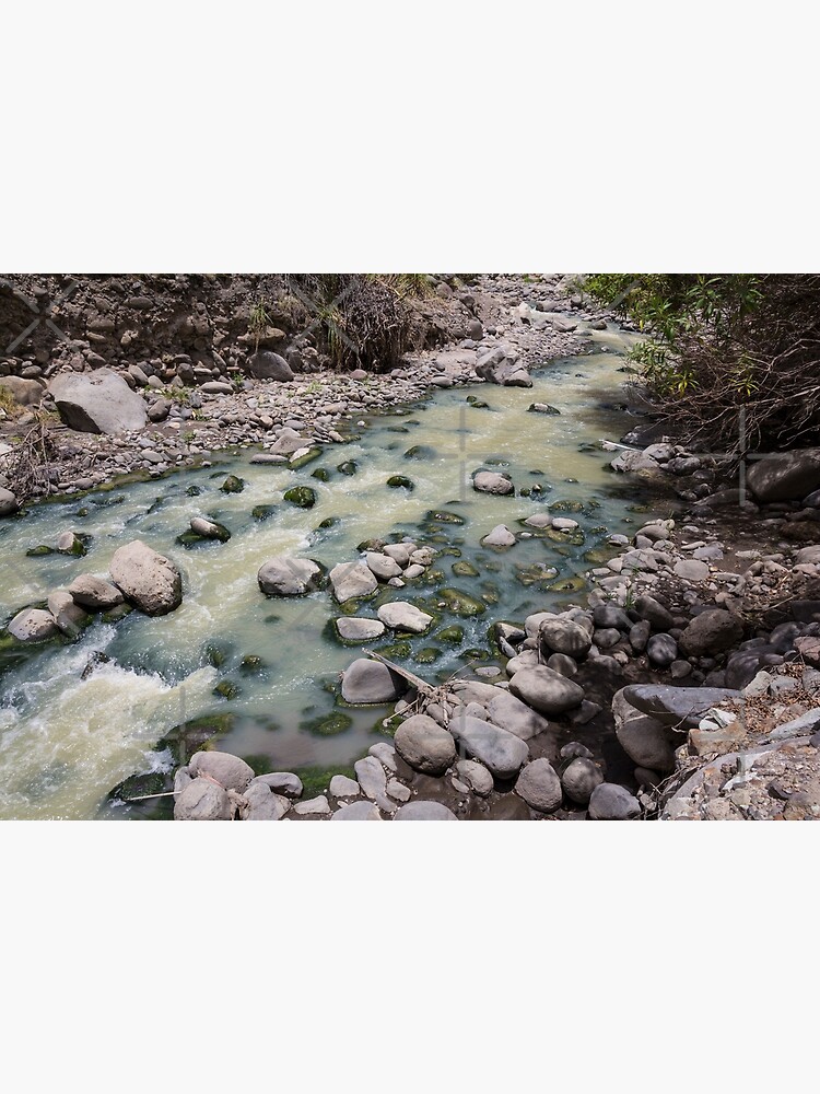 Green rushing water over rocks at base of valley, Sibambe, Ecuador by kpander