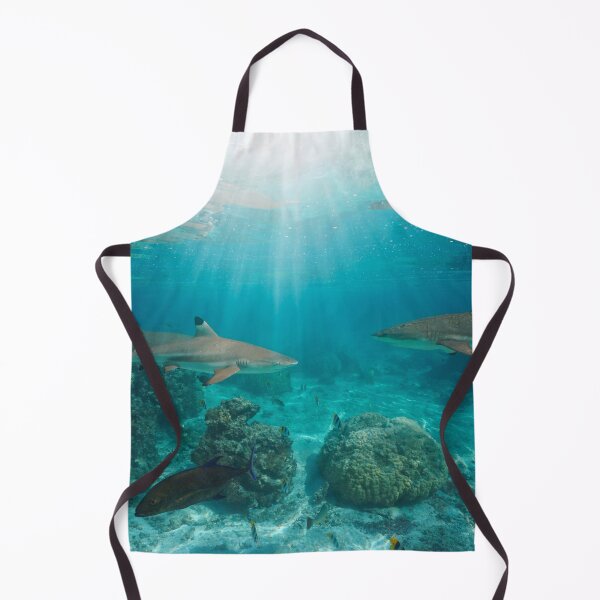 Item preview, Sunlight underwater with blacktip reef sharks below water surface designed and sold by Seaphotoart.