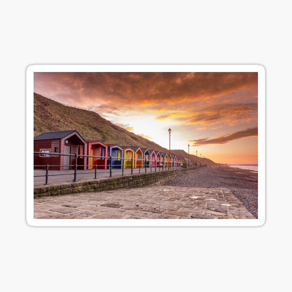 Saltburn beach huts at sunset Sticker