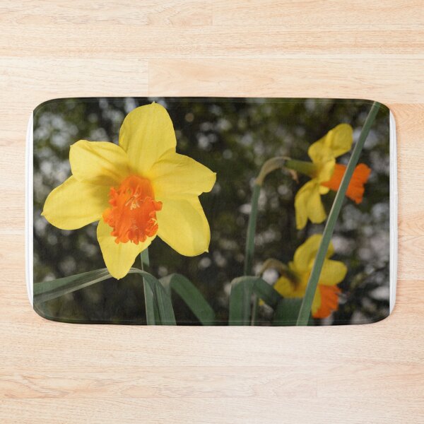 Item preview, Bright yellow orange Narcissus Daffodil on green background designed and sold by thesuspire.