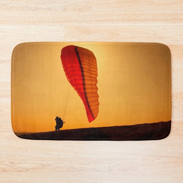 Item preview, A paraglider athlete running towards freedom on a windy sunset designed and sold by fotoryum.