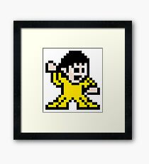 Pixel art inspired art of Bruce Lee Framed Print