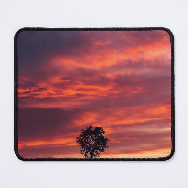 Item preview, Digital photograph of tree silhouette against a dramatic sunset sky designed and sold by SimonJohnson1.
