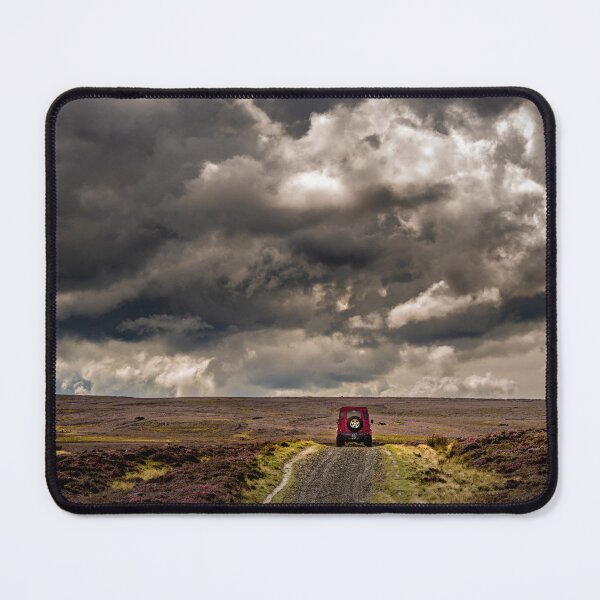 Item preview, Red off-roader car under stormy skies on moorland designed and sold by bailey-cooper.