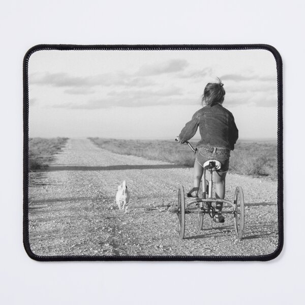 Item preview, Girl riding a tricycle down a gravel road. designed and sold by John White Photos.