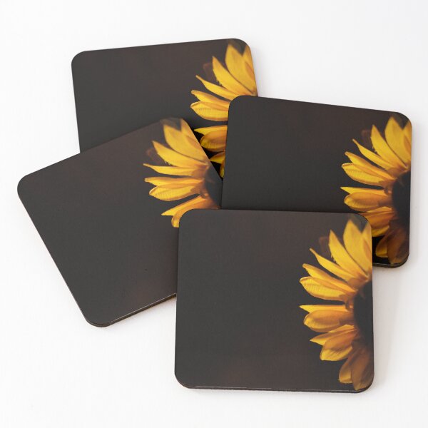 Item preview, Yellow sunflower in darkness with light shining through its petals designed and sold by Amanda Creamer.