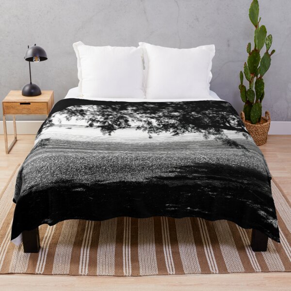 Item preview, Black and White photo of trees on the seashore, framing the tranquil sea water designed and sold by IdoFriedmanArt.