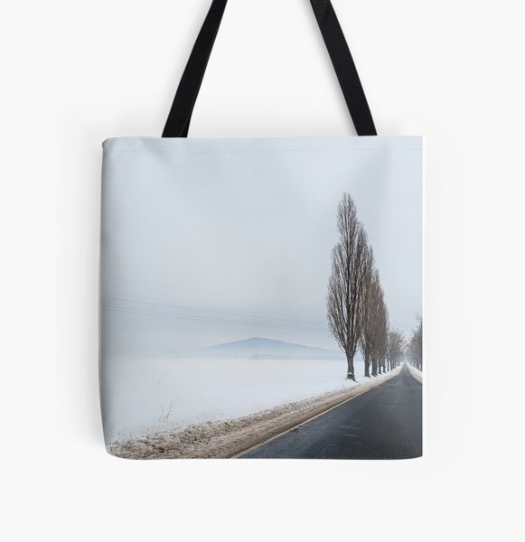 Winter alone mountain trees road fog All Over Print Tote Bag