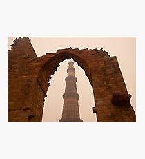 Cross section of the Qutub Minar framed within an archway in foggy weather Photographic Print