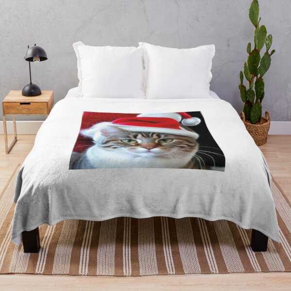 Item preview, Christmas Cat on white background. Studio portrait of a ginger cat wearing Santa Claus xmas red cap looks up. Merry Christmas. Greeting card. Happy New Year 2024. Cat with Santa hat. Copy space designed and sold by paolboa.