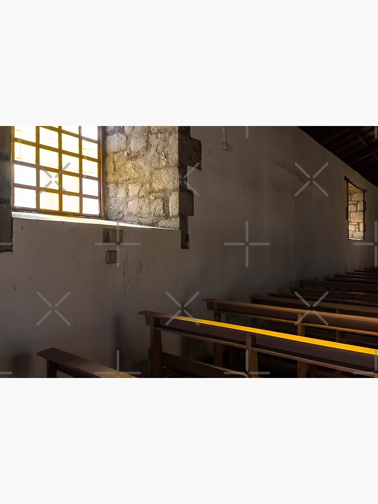Soft light from window well on to church pews, through stone block wall, Colta, Ecuador by kpander