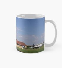 old crop duster airplanes on airfield Mug