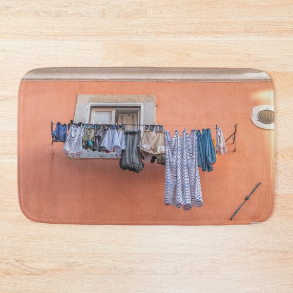 Item preview, Clothes lines on a terracotta building in Alfama, Lisbon, Portugal - colorful travel photography designed and sold by Christa Stroo Photography.