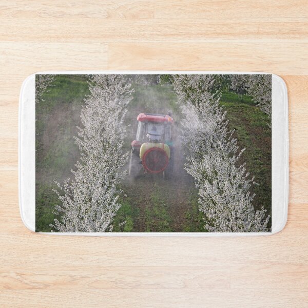Item preview, tractor sprays insecticide in orchard agriculture industry springtime designed and sold by goceris.