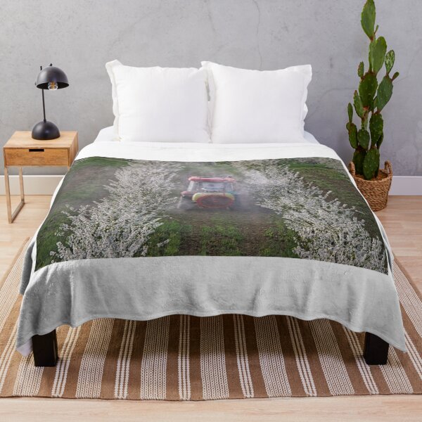Item preview, tractor sprays insecticide in orchard agriculture industry springtime designed and sold by goceris.