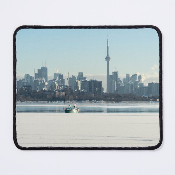Item preview, Unusual Sight - Frozen Lake Ontario Toronto Skyline and a Sailboat designed and sold by Georgia Mizuleva.