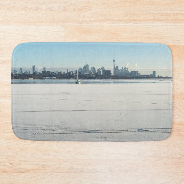 Item preview, Lake Ontario Ice and Snow Expanse with Toronto Skyline and a Sailboat designed and sold by Georgia Mizuleva.