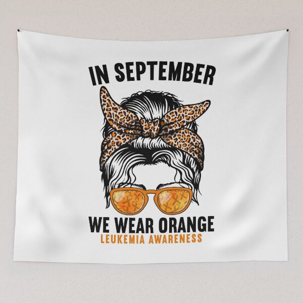 Item preview, In September We Wear Orange Leukemia Awareness Messy Bun designed and sold by MobyStickers.