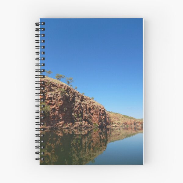 Item preview, Reflection of a red cliff face with trees in a blue river designed and sold by EAnneH.