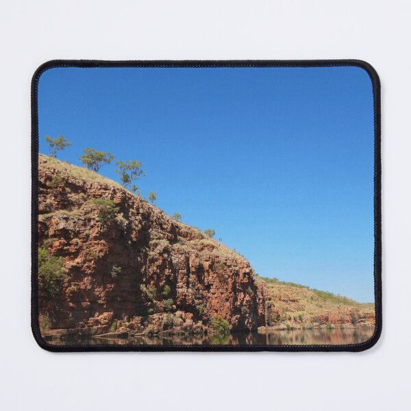 Item preview, Reflection of a red cliff face with trees in a blue river designed and sold by EAnneH.
