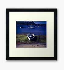Boat on a lake Framed Print