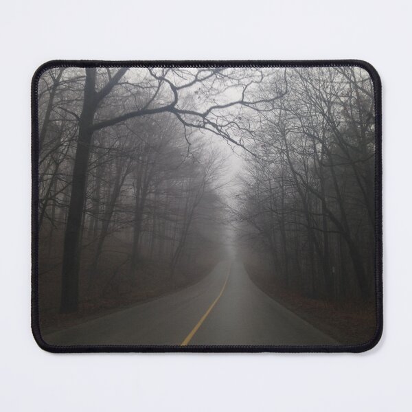 Item preview, A spooky forest road with barren trees creating a foggy canopy designed and sold by AlishaWatson.