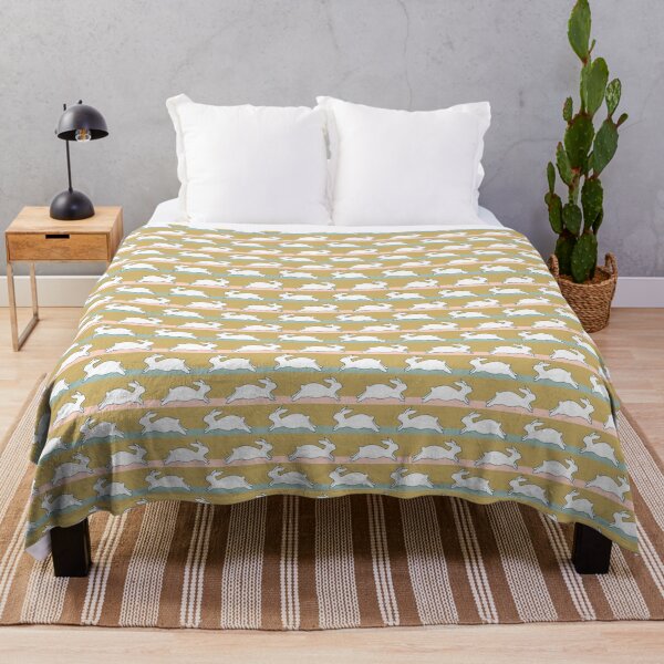 Item preview, white running rabbits on colorful stripes designed and sold by colorofmagic.