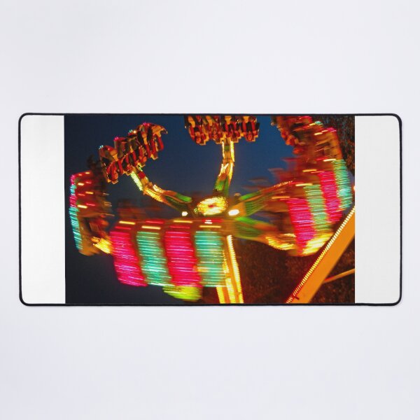 Item preview, People riding a spinning carnival ride at night designed and sold by Michael Brewer.