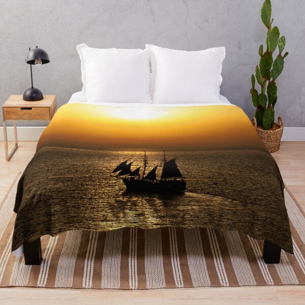 Item preview, Color photography of Sailing boat navigate in golden light designed and sold by IdoFriedmanArt.