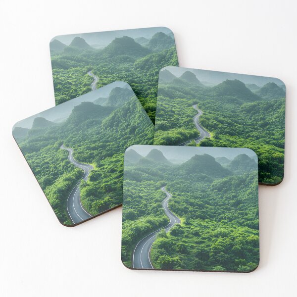 Item preview, an aerial view of a winding road cutting through dense, green forests designed and sold by artumbre.