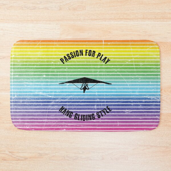 Item preview, Black silhouette of woman flying a hang glider against the background of rainbow stripes designed and sold by HarridanCreates.