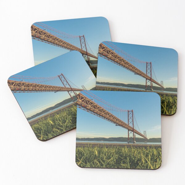 Item preview, the bridge over the Tejo River seen from the bank with person on a bicycle in Lisbon, Portugal designed and sold by jpferreiraphoto.