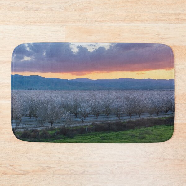Item preview, Atmospheric Sunset over Almond Blooming Orchards in California Central Valley designed and sold by yhelfman.